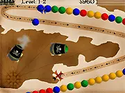 Screenshot of the bubble shooter game Blackbeard's Island showing a cannon aiming at a long chain of multicolored pirate cannonballs. Play free online on PlayArcadeHub.
