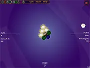 Screenshot of the Heximator game interface showing a hexagonal base with various colored hex tiles attached and a moving grabber device ready to catch an incoming tile.