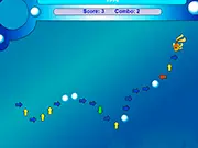 Screenshot of Fish Quest game, showing a small fish navigating a challenging underwater level and directional arrows indicating the required key presses. Play Fish Quest online.