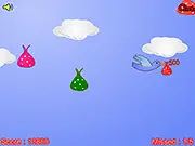 Screenshot of the Catching Baby Birds free online arcade game showing a basket moving to catch small, falling yellow baby birds against a bright blue sky.