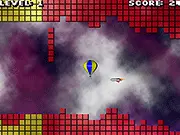 A colorful hot air balloon flying through a narrow, obstacle-filled tunnel in the free online challenge game Balloon Ride 2