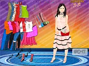 Screenshot of the Penelope Cruz Dress Up online game on PlayArcadeHub showing the celebrity model and a selection of dresses and accessories.