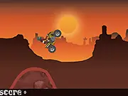 An ATV driving across a canyon landscape, mid-air over a jump while performing a stunt in the free online game ATV Canyon Stunts