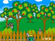 Fruit slingshot aiming at crows perched on a garden wall in the physics-based free online game Garden Defender