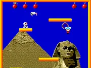 The hero Jack flying mid-air to collect a large bomb while avoiding a red enemy on a multi-layered platform from the Bomb Jack classic arcade game