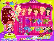 Angie Angel Dressup game screen showing a cute fairy girl being styled with wings, a dress, and accessories in a magical forest setting.
