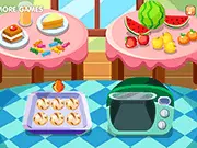 Playing the Make Olive Rolls free online cooking game, showing the process of mixing and shaping dough with green olives.