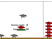Screenshot of Collect the Bunnies free online game showing a movable tray ready to collect small, colorful bunnies against a bright background.