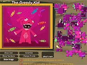 Gameplay image of the free online game Spooky Puzzle, showing a partially completed jigsaw puzzle with a spooky Halloween image.