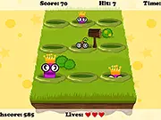 The Worm Mania game screen showing multiple cartoon worms quickly popping out of holes, ready to be smashed.