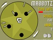 Play Maggotz free online: screenshot of small maggots being guided toward holes away from a central skull hazard