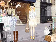 Tanya Dress Up game screenshot showing a girl trying on a fashionable dress and accessories, a popular free online dress up game