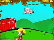 Pig Poo Power free online arcade game screenshot showing flying pigs and a collection bucket underneath to collect energy.