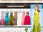 Screenshot from the Couture Prom Dresses game showing a glamorous female model wearing a flowing evening gown and posing on a red carpet.