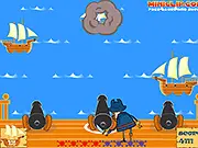 Cannon Blast free online game screenshot showing a lit cannon and a cannonball flying towards wooden enemy ships on a sea level.