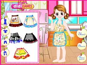 A screenshot of the Girl's Cooking (Lisa's Cooking Show) dress up game showing Lisa standing in a stylized kitchen set with various fashionable chef outfits and accessories available to choose from.