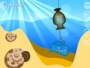 Gameplay screenshot of Seabed Cleaner showing a beautiful, clear blue ocean floor with various items of trash like bottles and metal being carefully lifted by a mechanical grabber controlled by the player.