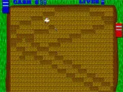 A player using a paddle to control a ball that is harvesting crops and animals on a farm field in the PongFarm online game
