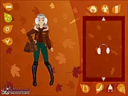 Screenshot of Autumn Mood Dress Up game showing a girl in a stylish layered fall outfit, including a sweater and boots, surrounded by autumn leaves