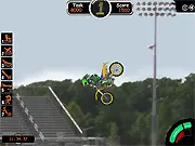 Screenshot of the free online bike stunt game Supreme Stunts on PlayArcadeHub, showing a motorcycle rider performing a flip over a large ramp on a dirt track.