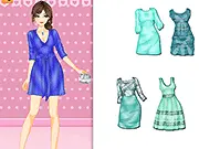 Cute animated girl wearing a stylish dress in various shades of aqua and turquoise in the Aqua Hues Dress Up online game