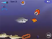 Screenshot of the Ocean Odyssey online game showing a small fish swimming in the deep blue ocean, surrounded by smaller minnows to eat and dodging a large shark.