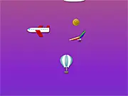 Eolo free online game showing the little girl Stella and Eolo (Aeolus) in a hot air balloon flying past enemies and collecting orange juice in space.