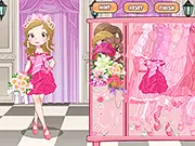 Screenshot of the Pink Bride Dress Up game showing a smiling animated bride figure in a beautiful pink wedding gown with a matching bouquet.