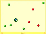 Gameplay screenshot of Next Avoider 2 online showing a small blue ball moving through a maze, surrounded by several dangerous red balls and collecting a green ball.