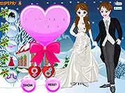 Screenshot of the Snowy Couple Wedding Dress Up game showing a handsome groom and a beautiful bride standing together in elegant winter wedding attire against a snowy, forest background.