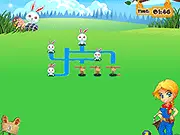 Rabbits and Eggs free online puzzle game screenshot, showing path tiles being connected to link a white bunny to holes and Easter eggs