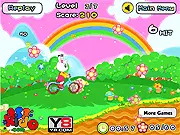 Ride My Bicycle game screenshot, showing a cyclist riding a mountain bike over a hilly, green track, collecting gold coins.