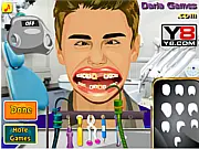 Justin Bieber Dentist Care free online game screenshot showing the singer in a dentist chair with tools being used to clean his painful teeth on PlayArcadeHub.