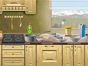 Gameplay screenshot showing the Popcorn Chicken Cooking game, with chicken pieces, flour, and frying oil ready on a kitchen counter.
