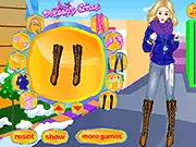 Screenshot of Cool Winter Fashion Dress Up game showing a model wearing a stylish layered winter outfit with a colorful hat, coat, and scarf. Free online makeover game.