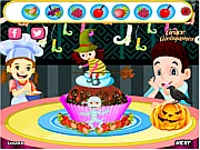 Happy Halloween Cupcake cooking game screenshot on PlayArcadeHub showing a beautifully decorated cupcake with spooky orange and black frosting.