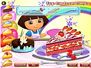 Dora Yummy Cake Decorator game screenshot showing a cake being decorated with colorful cream, sprinkles, and toppings - Play free online