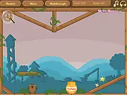 A bear character navigating a platform obstacle course using floating bubble physics to reach a pot of sweet honey in a free online puzzle game