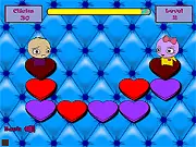Hearts Apart game screen showing a 5x5 grid of red and white heart tiles, with a couple figures separated on opposite sides of the grid. Play free online logic puzzle game.