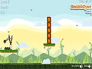 Screenshot of Bomb The Boxes game, showing a bomb about to explode near stacked wooden crates and boxes on a platform.