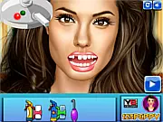 The Celebrity Dentist game screen showing various dental tools and a patient ready for a tooth cleaning and makeover