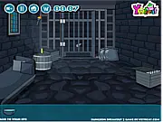 The interior of a dark, stone dungeon cell with a chain and wooden door, the setting for the free online puzzle game Dungeon Breakout 2