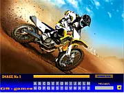 Bike Stunts Hidden Letters game showing a dirt bike rider performing a jump or stunt with the letters of the alphabet subtly hidden in the photo