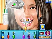 Gameplay screenshot from Star Smile Dental Care, showing a dentist using professional tools to clean a patient's teeth.
