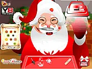 Santa at the Doctor free online Christmas simulation game, treating Santa's wounds after a chimney accident