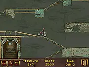 Moto Tomb Racer 2 free online game screenshot, showing a motorbike performing a large jump over deadly spikes inside a dark Mayan temple dungeon on PlayArcadeHub.