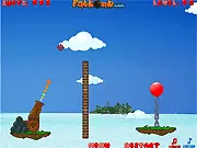Screenshot of Balloon Bombardier online game: A cannon aiming at a complex contraption designed to start a chain reaction to pop scattered balloons.