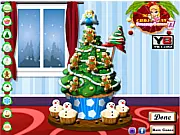 Screenshot of the free online game Cupcake Christmas Tree Decoration, showing a tiered stand of green-frosted cupcakes arranged into a Christmas tree shape, ready for decoration with sprinkles and candies.