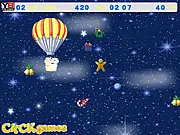 Christmas Parachute online game screen showing Santa Claus with a parachute collecting falling wrapped gifts against a snowy backdrop