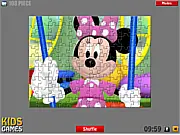 Play Minnie Mouse Puzzles online free, solving a jigsaw or sliding puzzle featuring the smiling Minnie Mouse character